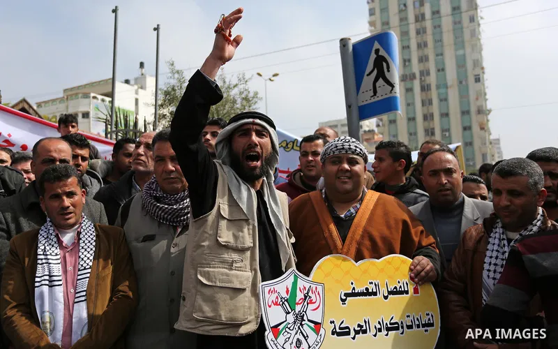 Palestinian supporters Fatah movement take part during a protest against the administrative detention, in Gaza city, on February 26, 2017. Photo by Ashraf Amra