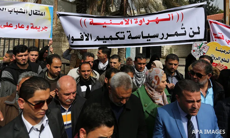 Palestinian supporters Fatah movement take part during a protest against the administrative detention, in Gaza city, on February 26, 2017. Photo by Ashraf Amra