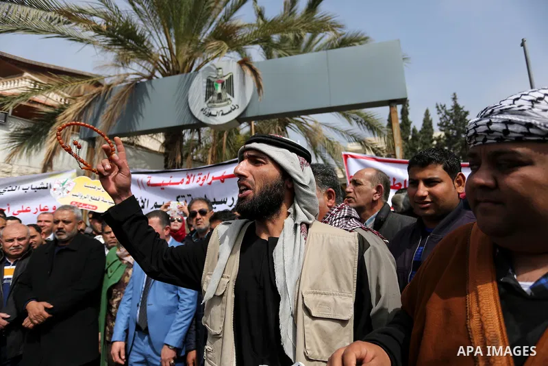 Palestinian supporters Fatah movement take part during a protest against the administrative detention, in Gaza city, on February 26, 2017. Photo by Ashraf Amra