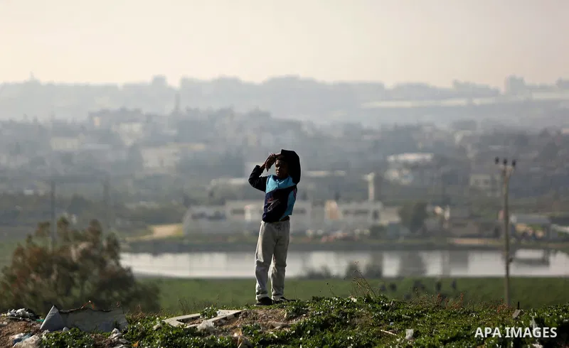 A Palestinian boy looks on in Beit Lahia, near the border with Israel, in the northern Gaza Strip, on February 27, 2017. Photo by Ashraf Amra