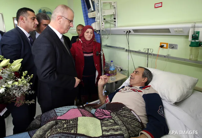 Palestinian Prime Minister Rami Hamdallah visits the Arab hospital of Beit Jala society for Rehabilitation, in the West Bank city of Beit Jala on February 28, 2017. Photo by Prime Minister Office