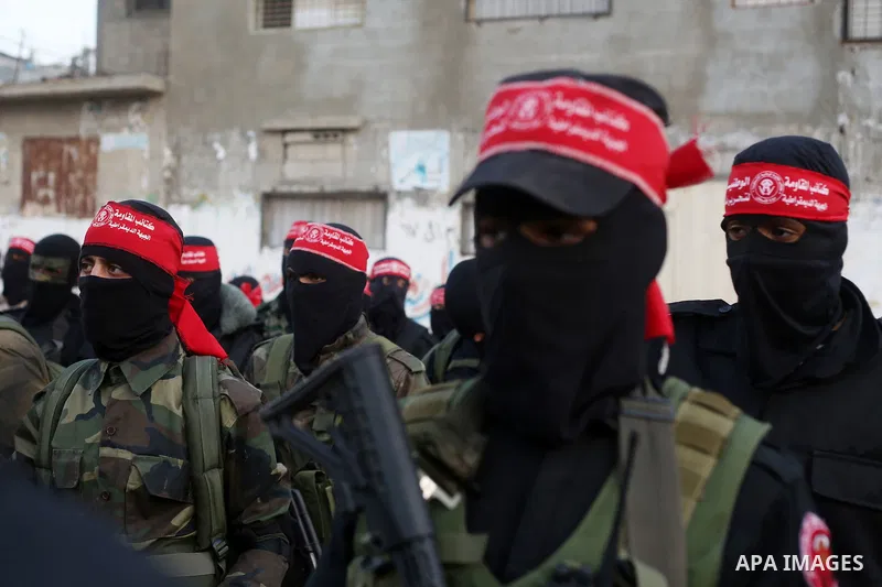 Palestinian militants of the Democratic Front for the Liberation of Palestine (DFLP) take part in a military show in Rafah in the southern Gaza Strip February 28, 2017. Photo by Ashraf Amra