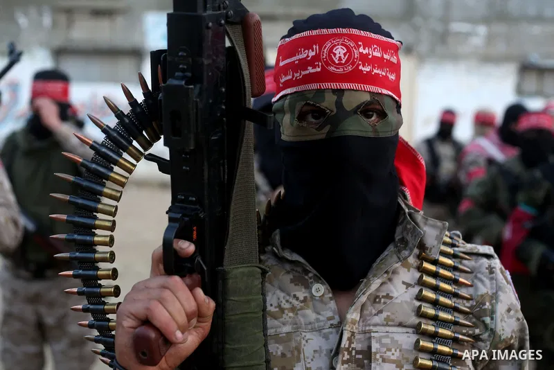 Palestinian militants of the Democratic Front for the Liberation of Palestine (DFLP) take part in a military show in Rafah in the southern Gaza Strip February 28, 2017. Photo by Ashraf Amra