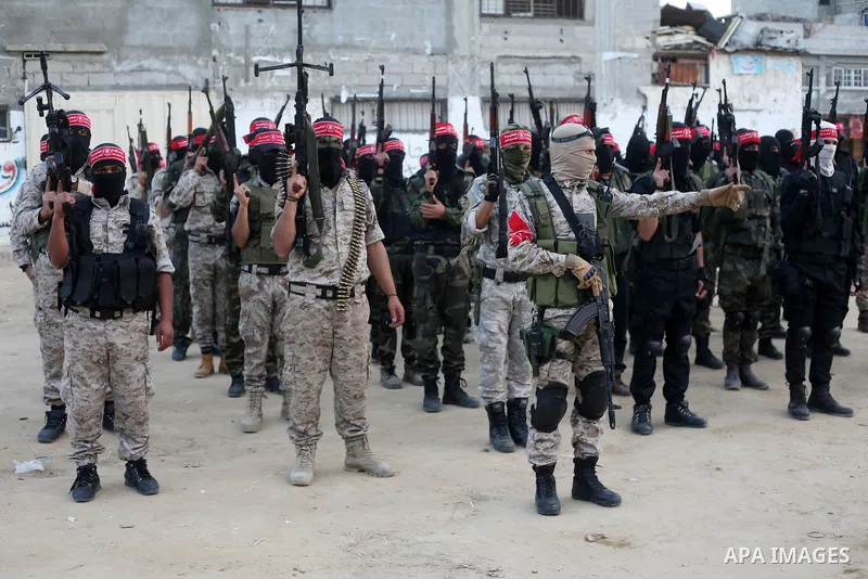 Palestinian militants of the Democratic Front for the Liberation of Palestine (DFLP) take part in a military show in Rafah in the southern Gaza Strip February 28, 2017. Photo by Ashraf Amra