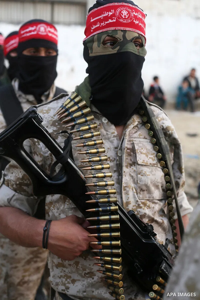 Palestinian militants of the Democratic Front for the Liberation of Palestine (DFLP) take part in a military show in Rafah in the southern Gaza Strip February 28, 2017. Photo by Ashraf Amra