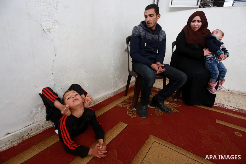 Wael Gharbaoui, a 6-year-old Palestinian boy, demonstrates acrobatics skills at his house in Jabalia refugee camp in the northern Gaza Strip, on March 01, 2017. Photo by Mohammed Asad