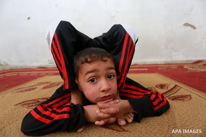 Wael Gharbaoui, a 6-year-old Palestinian boy, demonstrates acrobatics skills at his house in Jabalia refugee camp in the northern Gaza Strip, on March 01, 2017. Photo by Mohammed Asad