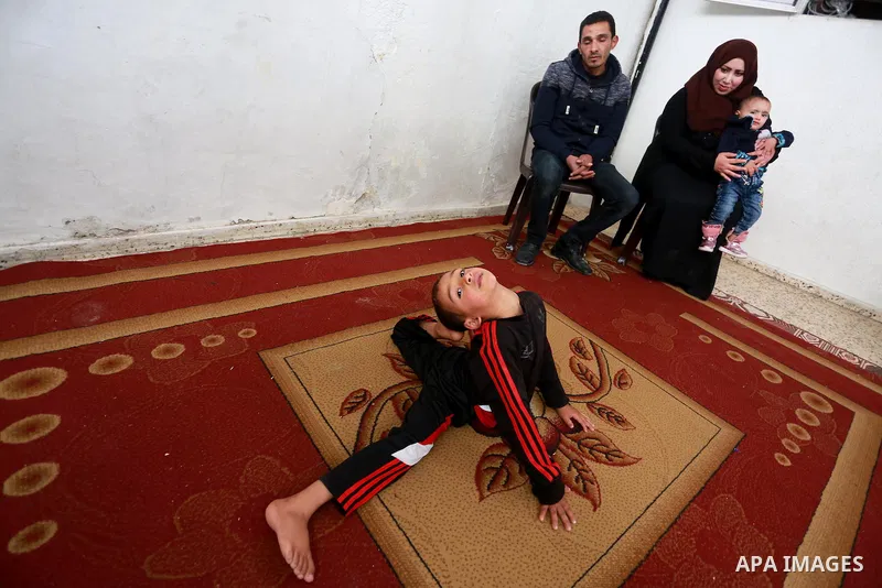 Wael Gharbaoui, a 6-year-old Palestinian boy, demonstrates acrobatics skills at his house in Jabalia refugee camp in the northern Gaza Strip, on March 01, 2017. Photo by Mohammed Asad