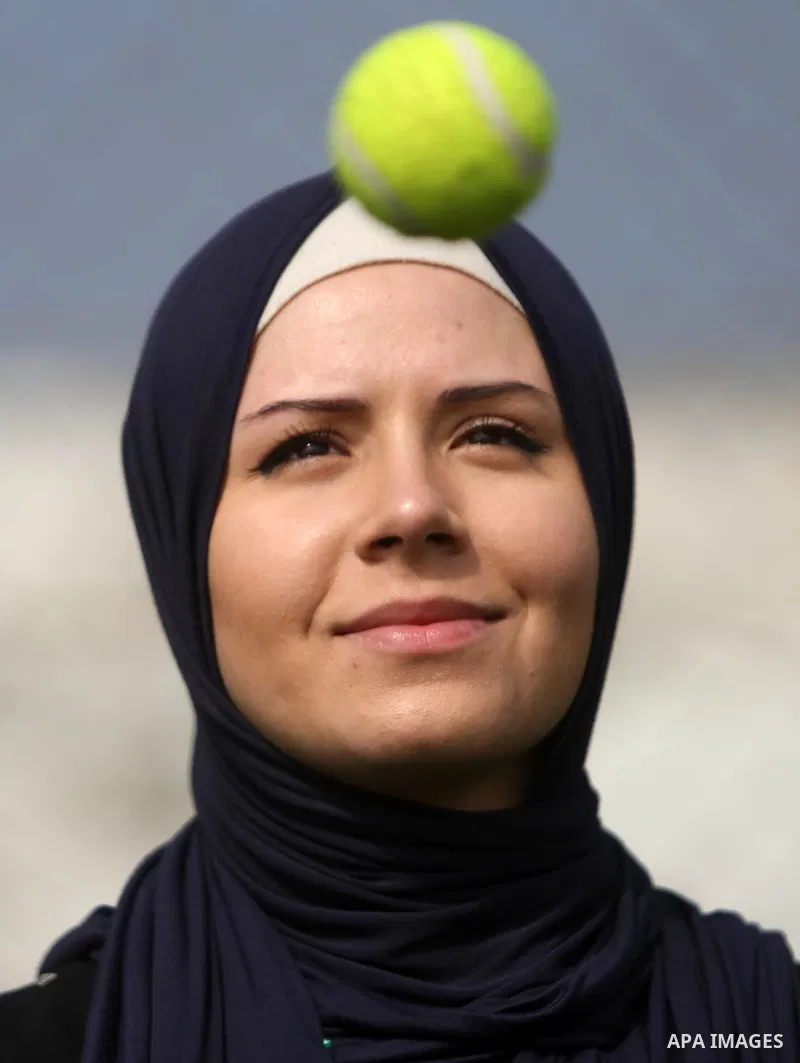 A Palestinian girl takes part in Baseball training, in Gaza city, on February 20, 2017. Baseball is a bat-and-ball game played between two teams of nine players each, who take turns batting and fielding. Baseball is thou...