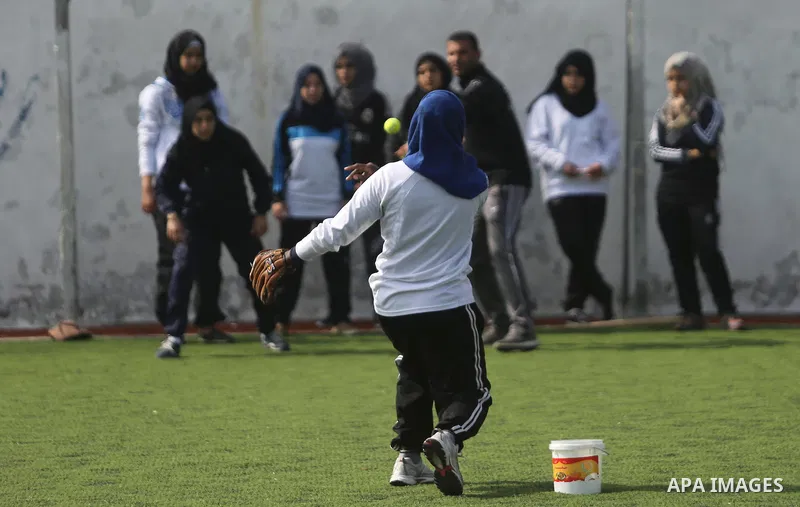 Palestinian girls take part in Baseball training, in Gaza city, on February 20, 2017. Baseball is a bat-and-ball game played between two teams of nine players each, who take turns batting and fielding. Baseball is though...