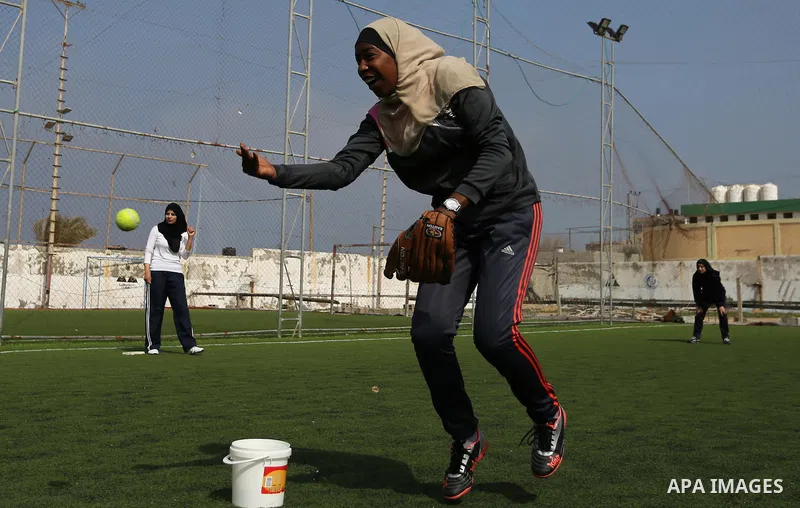 A Palestinian girl takes part in Baseball training, in Gaza city, on February 20, 2017. Baseball is a bat-and-ball game played between two teams of nine players each, who take turns batting and fielding. Baseball is thou...