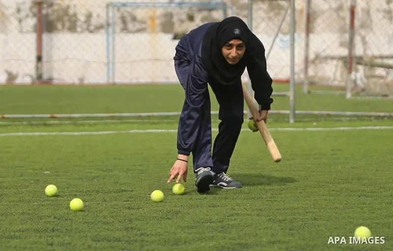 A Palestinian girl takes part in Baseball training, in Gaza city, on February 20, 2017. Baseball is a bat-and-ball game played between two teams of nine players each, who take turns batting and fielding. Baseball is thou...