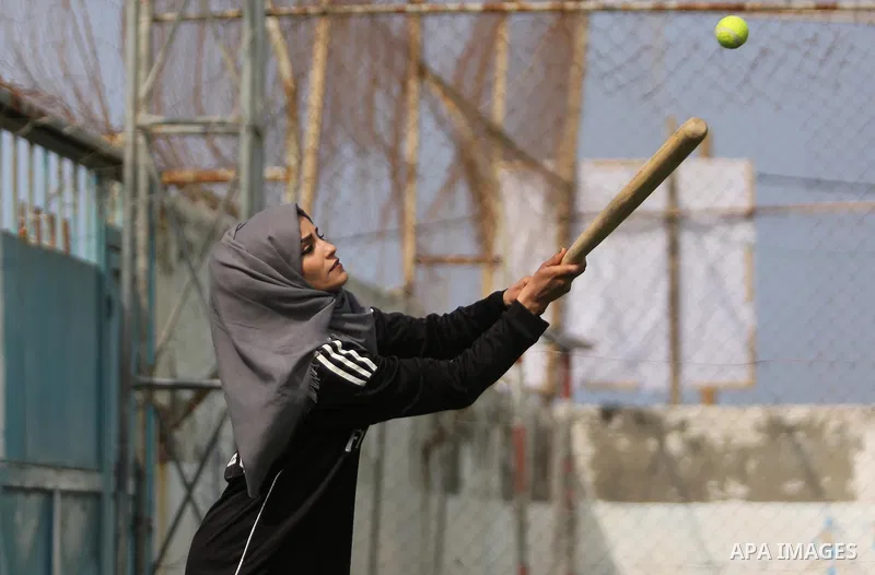 A Palestinian girl takes part in Baseball training, in Gaza city, on February 20, 2017. Baseball is a bat-and-ball game played between two teams of nine players each, who take turns batting and fielding. Baseball is thou...