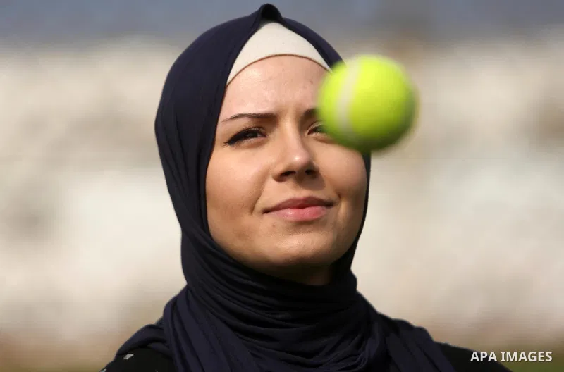 A Palestinian girl takes part in Baseball training, in Gaza city, on February 20, 2017. Baseball is a bat-and-ball game played between two teams of nine players each, who take turns batting and fielding. Baseball is thou...