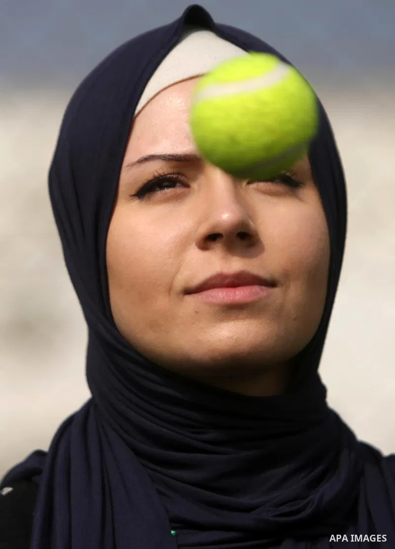 A Palestinian girl takes part in Baseball training, in Gaza city, on February 20, 2017. Baseball is a bat-and-ball game played between two teams of nine players each, who take turns batting and fielding. Baseball is thou...