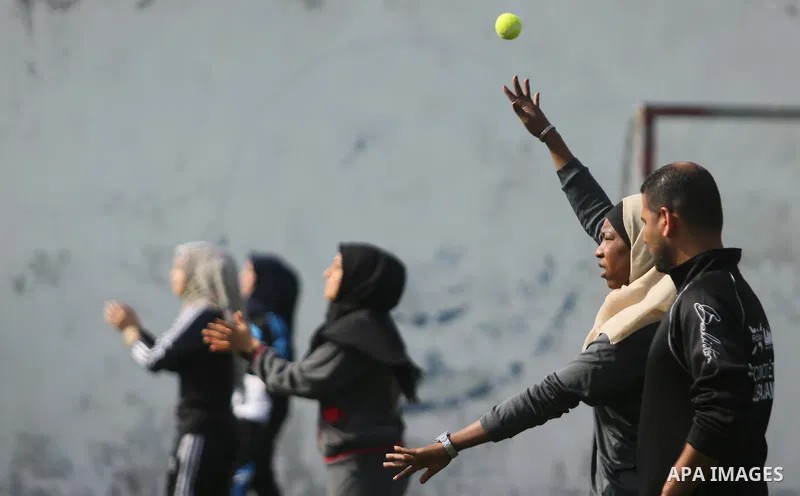 Palestinian girls take part in Baseball training, in Gaza city, on February 20, 2017. Baseball is a bat-and-ball game played between two teams of nine players each, who take turns batting and fielding. Baseball is though...