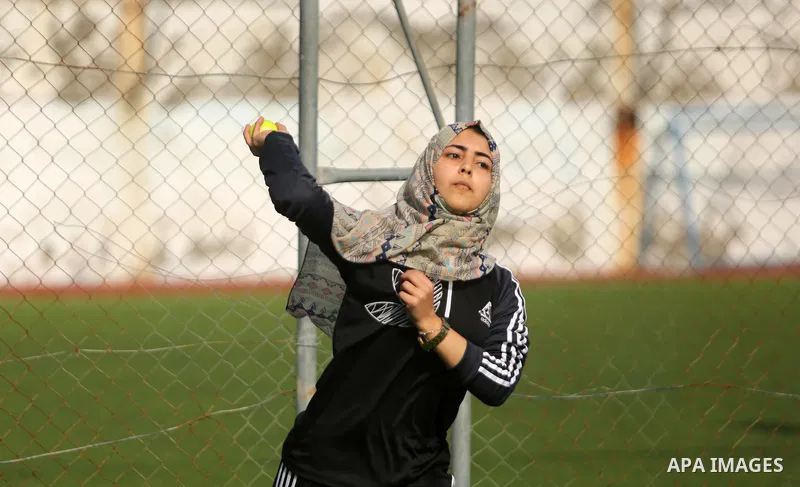A Palestinian girl takes part in Baseball training, in Gaza city, on February 20, 2017. Baseball is a bat-and-ball game played between two teams of nine players each, who take turns batting and fielding. Baseball is thou...