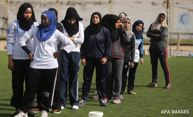 Palestinian girls take part in Baseball training, in Gaza city, on February 20, 2017. Baseball is a bat-and-ball game played between two teams of nine players each, who take turns batting and fielding. Baseball is though...
