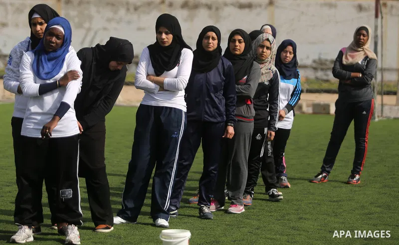 Palestinian girls take part in Baseball training, in Gaza city, on February 20, 2017. Baseball is a bat-and-ball game played between two teams of nine players each, who take turns batting and fielding. Baseball is though...
