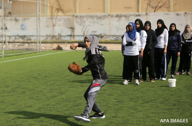 Palestinian girls take part in Baseball training, in Gaza city, on February 20, 2017. Baseball is a bat-and-ball game played between two teams of nine players each, who take turns batting and fielding. Baseball is though...