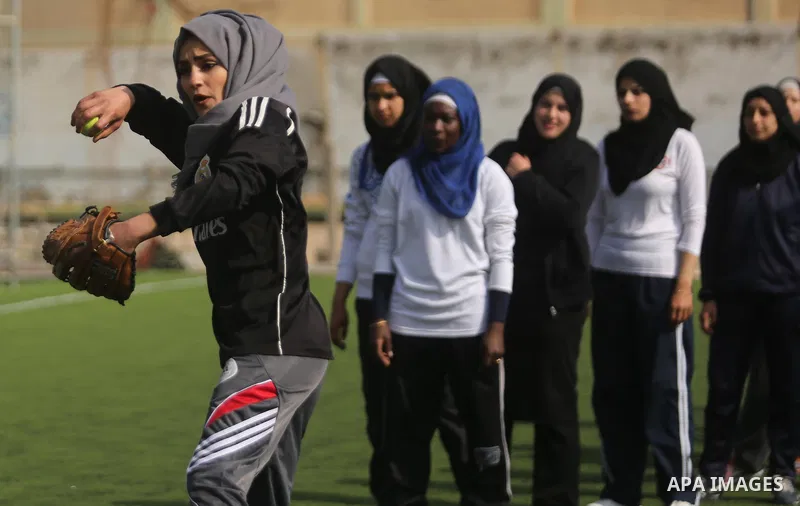Palestinian girls take part in Baseball training, in Gaza city, on February 20, 2017. Baseball is a bat-and-ball game played between two teams of nine players each, who take turns batting and fielding. Baseball is though...
