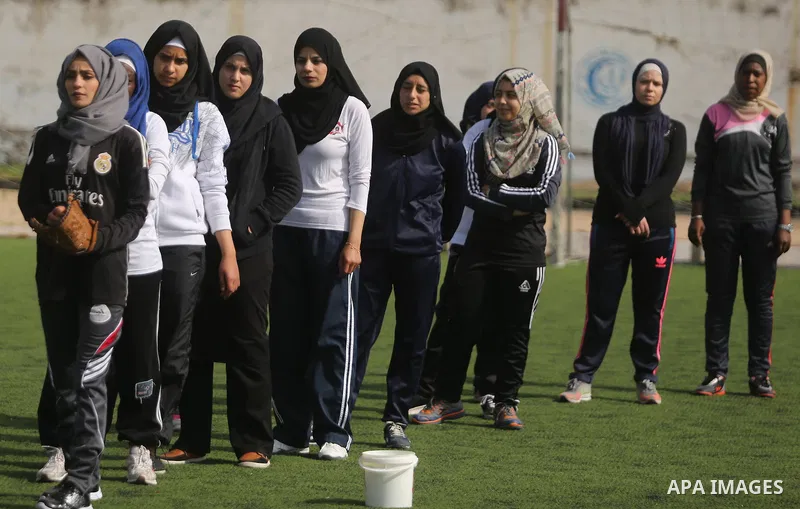 Palestinian girls take part in Baseball training, in Gaza city, on February 20, 2017. Baseball is a bat-and-ball game played between two teams of nine players each, who take turns batting and fielding. Baseball is though...