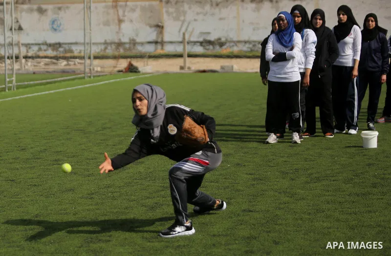 Palestinian girls take part in Baseball training, in Gaza city, on February 20, 2017. Baseball is a bat-and-ball game played between two teams of nine players each, who take turns batting and fielding. Baseball is though...