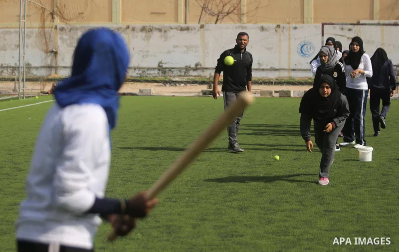 Palestinian girls take part in Baseball training, in Gaza city, on February 20, 2017. Baseball is a bat-and-ball game played between two teams of nine players each, who take turns batting and fielding. Baseball is though...
