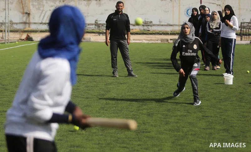 Palestinian girls take part in Baseball training, in Gaza city, on February 20, 2017. Baseball is a bat-and-ball game played between two teams of nine players each, who take turns batting and fielding. Baseball is though...