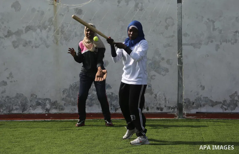 Palestinian girls take part in Baseball training, in Gaza city, on February 20, 2017. Baseball is a bat-and-ball game played between two teams of nine players each, who take turns batting and fielding. Baseball is though...