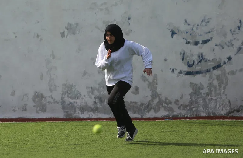 A Palestinian girl takes part in Baseball training, in Gaza city, on February 20, 2017. Baseball is a bat-and-ball game played between two teams of nine players each, who take turns batting and fielding. Baseball is thou...