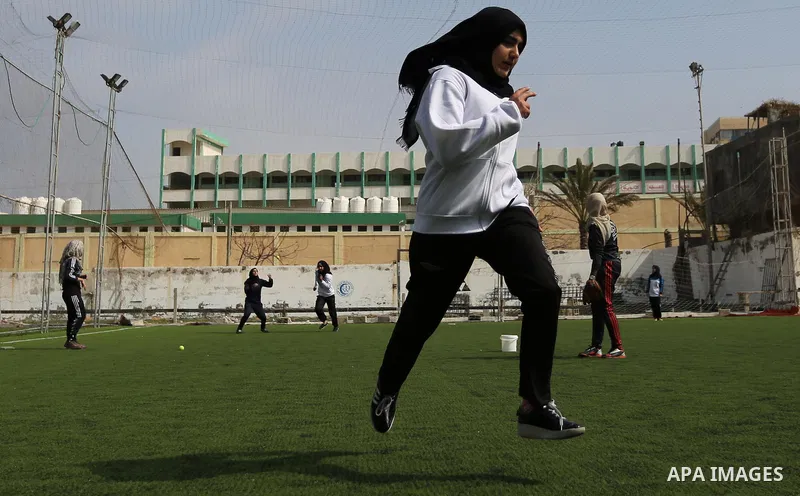 A Palestinian girl takes part in Baseball training, in Gaza city, on February 20, 2017. Baseball is a bat-and-ball game played between two teams of nine players each, who take turns batting and fielding. Baseball is thou...