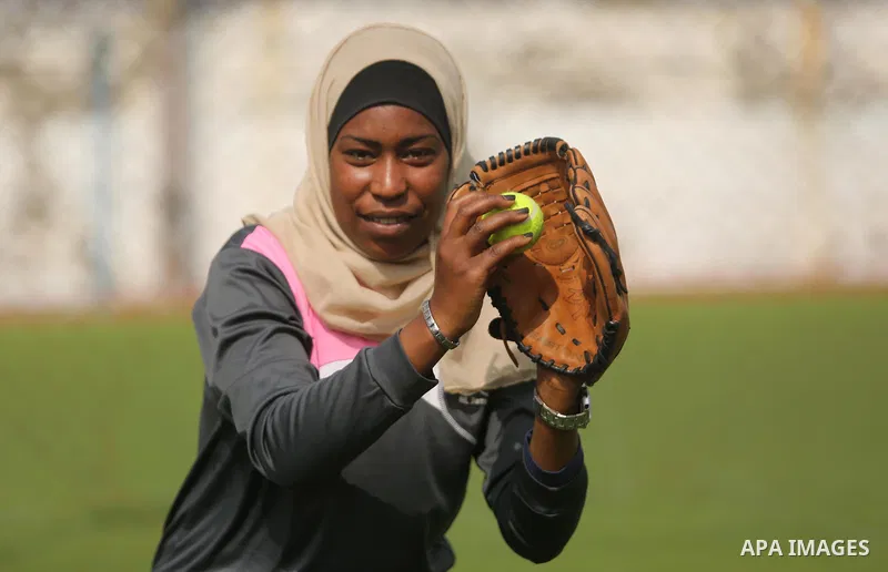 A Palestinian girl takes part in Baseball training, in Gaza city, on February 20, 2017. Baseball is a bat-and-ball game played between two teams of nine players each, who take turns batting and fielding. Baseball is thou...
