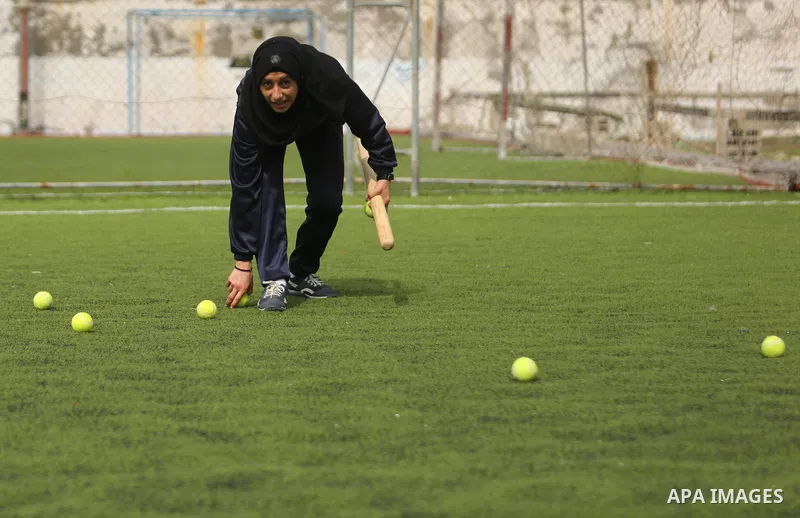 A Palestinian girl takes part in Baseball training, in Gaza city, on February 20, 2017. Baseball is a bat-and-ball game played between two teams of nine players each, who take turns batting and fielding. Baseball is thou...