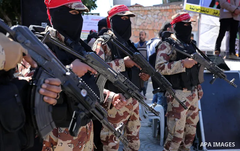 Palestinian militants of the Democratic Front for the Liberation of Palestine (DFLP) take part in a rally marking the 48th anniversary of DFLP foundation in Gaza city on March 04, 2017. Photo by Ashraf Amra