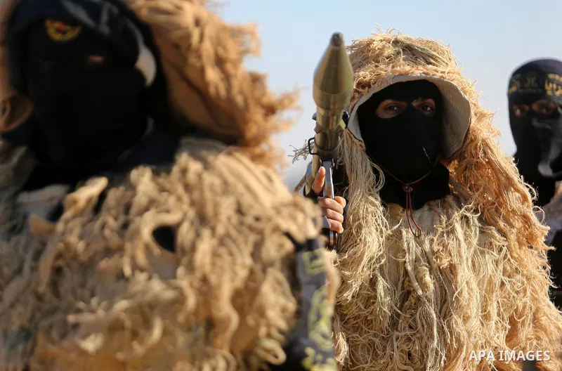 Palestinian militants from the Al-Quds Brigades, the armed wing of the Islamic Jihad movement, take part in a military parade, in Khan younis in the southern Gaza strip, on March 4, 2017. Photo by Ashraf Amra