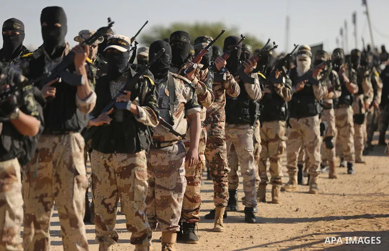 Palestinian militants from the Al-Quds Brigades, the armed wing of the Islamic Jihad movement, take part in a military parade, in Khan younis in the southern Gaza strip, on March 4, 2017. Photo by Ashraf Amra