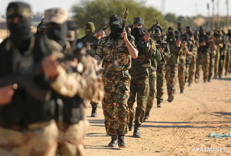Palestinian militants from the Al-Quds Brigades, the armed wing of the Islamic Jihad movement, take part in a military parade, in Khan younis in the southern Gaza strip, on March 4, 2017. Photo by Ashraf Amra