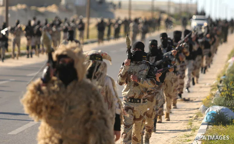 Palestinian militants from the Al-Quds Brigades, the armed wing of the Islamic Jihad movement, take part in a military parade, in Khan younis in the southern Gaza strip, on March 4, 2017. Photo by Ashraf Amra