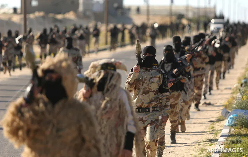 Palestinian militants from the Al-Quds Brigades, the armed wing of the Islamic Jihad movement, take part in a military parade, in Khan younis in the southern Gaza strip, on March 4, 2017. Photo by Ashraf Amra