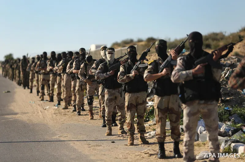 Palestinian militants from the Al-Quds Brigades, the armed wing of the Islamic Jihad movement, take part in a military parade, in Khan younis in the southern Gaza strip, on March 4, 2017. Photo by Ashraf Amra