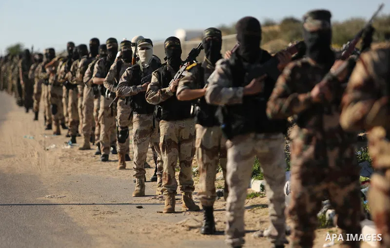 Palestinian militants from the Al-Quds Brigades, the armed wing of the Islamic Jihad movement, take part in a military parade, in Khan younis in the southern Gaza strip, on March 4, 2017. Photo by Ashraf Amra