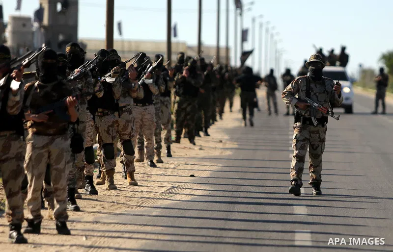 Palestinian militants from the Al-Quds Brigades, the armed wing of the Islamic Jihad movement, take part in a military parade, in Khan younis in the southern Gaza strip, on March 4, 2017. Photo by Ashraf Amra