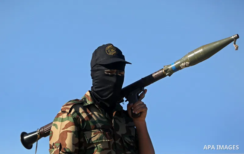 Palestinian militants from the Al-Quds Brigades, the armed wing of the Islamic Jihad movement, take part in a military parade, in Khan younis in the southern Gaza strip, on March 4, 2017. Photo by Ashraf Amra