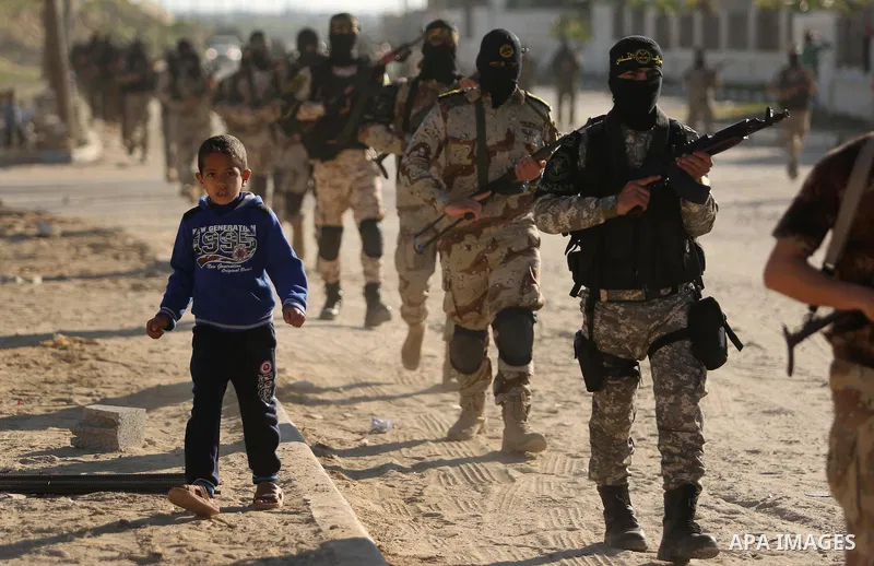Palestinian militants from the Al-Quds Brigades, the armed wing of the Islamic Jihad movement, take part in a military parade, in Khan younis in the southern Gaza strip, on March 4, 2017. Photo by Ashraf Amra