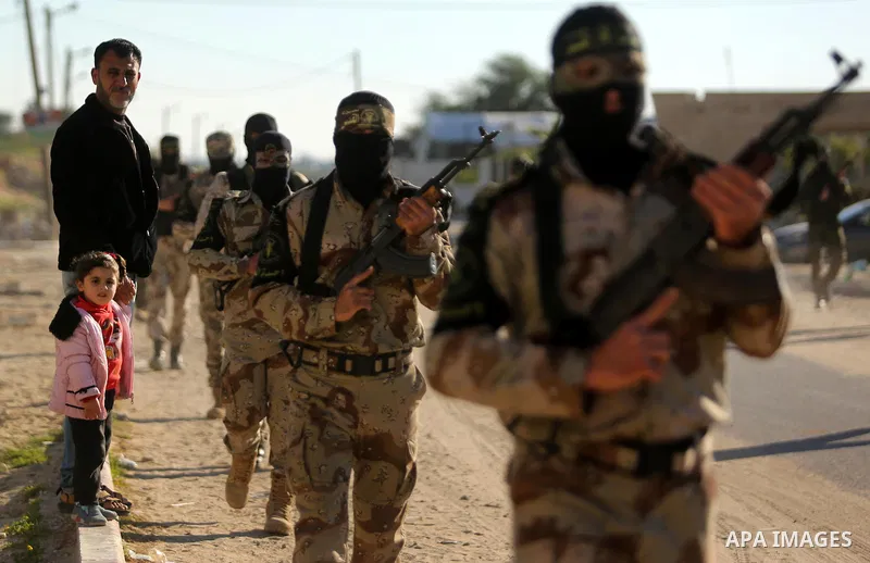 Palestinian militants from the Al-Quds Brigades, the armed wing of the Islamic Jihad movement, take part in a military parade, in Khan younis in the southern Gaza strip, on March 4, 2017. Photo by Ashraf Amra