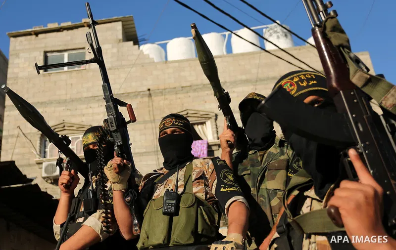 Palestinian militants from the Al-Quds Brigades, the armed wing of the Islamic Jihad movement, take part in a military parade, in Khan younis in the southern Gaza strip, on March 4, 2017. Photo by Ashraf Amra