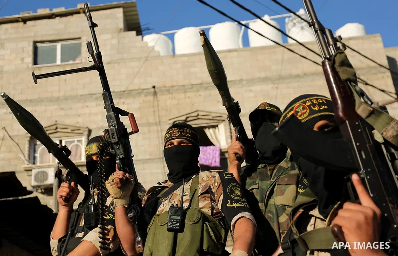 Palestinian militants from the Al-Quds Brigades, the armed wing of the Islamic Jihad movement, take part in a military parade, in Khan younis in the southern Gaza strip, on March 4, 2017. Photo by Ashraf Amra