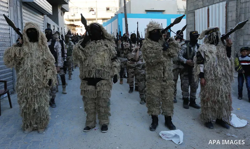 Palestinian militants from the Al-Quds Brigades, the armed wing of the Islamic Jihad movement, take part in a military parade, in Khan younis in the southern Gaza strip, on March 4, 2017. Photo by Ashraf Amra
