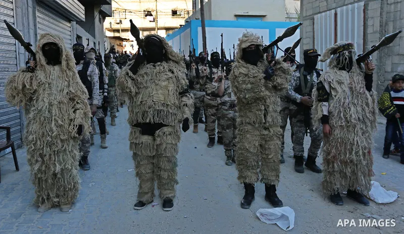 Palestinian militants from the Al-Quds Brigades, the armed wing of the Islamic Jihad movement, take part in a military parade, in Khan younis in the southern Gaza strip, on March 4, 2017. Photo by Ashraf Amra